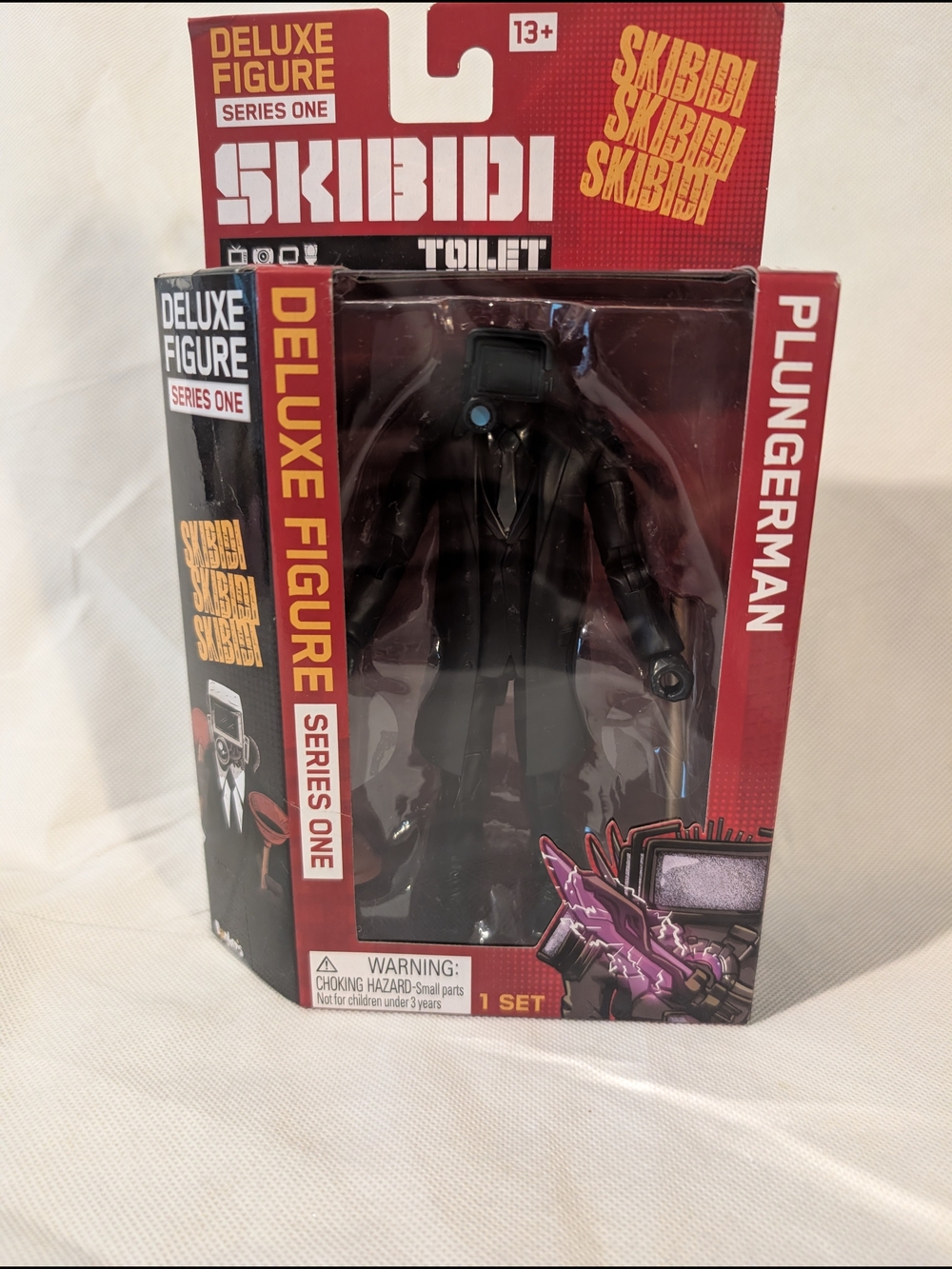 Skibidi Plungerman Deluxe Figure - Black Figure with Red Packaging